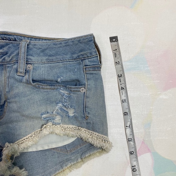 AE 4 shortie pom pom fringe distressed jean shorts - Picture 8 of 8